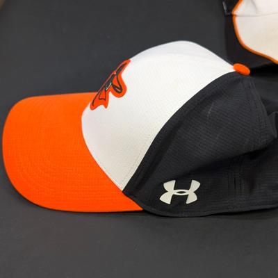 LOT 228: Baltimore Oriole Gear, Button Down Shortsleeve Shirt, Pullover, Sweatshirt, 2 Straw Hats, One Signed & 3 Baseball Caps. No...