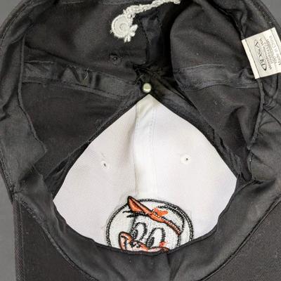 LOT 228: Baltimore Oriole Gear, Button Down Shortsleeve Shirt, Pullover, Sweatshirt, 2 Straw Hats, One Signed & 3 Baseball Caps. No...