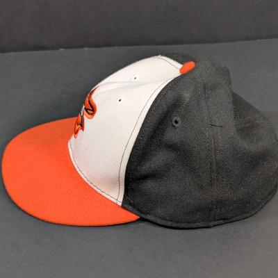 LOT 228: Baltimore Oriole Gear, Button Down Shortsleeve Shirt, Pullover, Sweatshirt, 2 Straw Hats, One Signed & 3 Baseball Caps. No...
