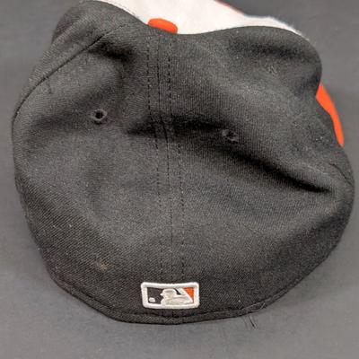 LOT 228: Baltimore Oriole Gear, Button Down Shortsleeve Shirt, Pullover, Sweatshirt, 2 Straw Hats, One Signed & 3 Baseball Caps. No...