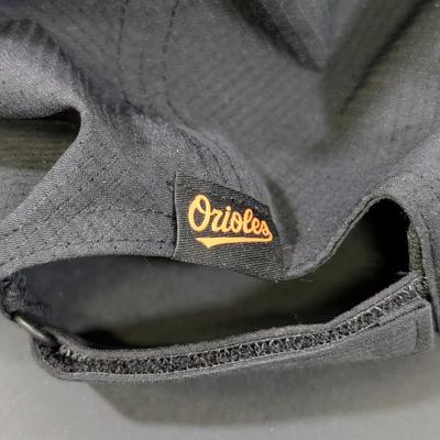 LOT 228: Baltimore Oriole Gear, Button Down Shortsleeve Shirt, Pullover, Sweatshirt, 2 Straw Hats, One Signed & 3 Baseball Caps. No...