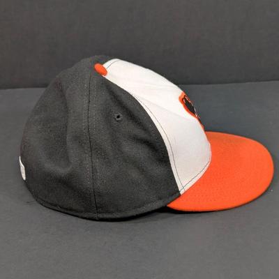 LOT 228: Baltimore Oriole Gear, Button Down Shortsleeve Shirt, Pullover, Sweatshirt, 2 Straw Hats, One Signed & 3 Baseball Caps. No...