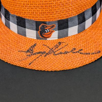 LOT 228: Baltimore Oriole Gear, Button Down Shortsleeve Shirt, Pullover, Sweatshirt, 2 Straw Hats, One Signed & 3 Baseball Caps. No...