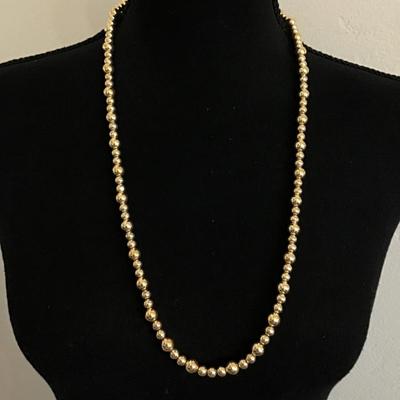 Vintage metallic gold tone beaded necklace with barrel clasp