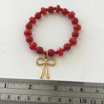 Red gold tone bow stretchy fashion bracelet