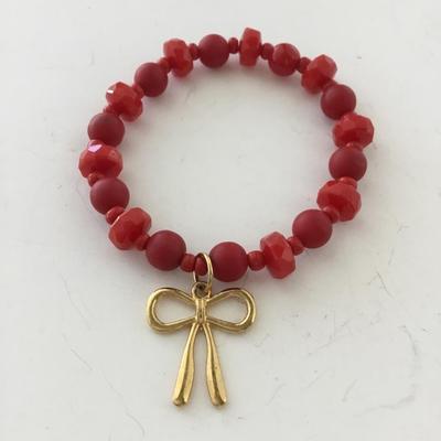 Red gold tone bow stretchy fashion bracelet