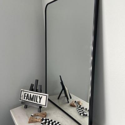 Family decor with black and white beads & black frame mirror