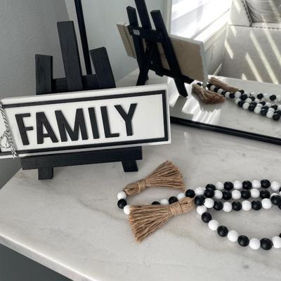 Sale Photo Thumbnail #5: Black curved framed metal mirror 
Handmade Family and picture holder 
Black & white wood beads and tassel