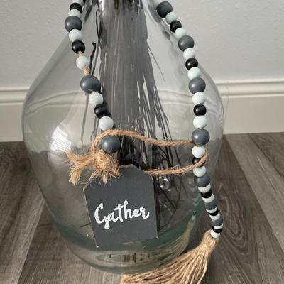 Large bottle with black cattails