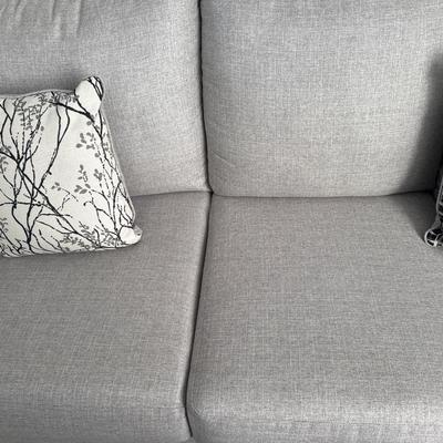 Sale Photo Thumbnail #75: L Shaped Couch is modern and is in great shape. No visible stains. Dimensions are long side is 10 ft long and short side was 93” long.
Includes accent pillows 
Does not include clock