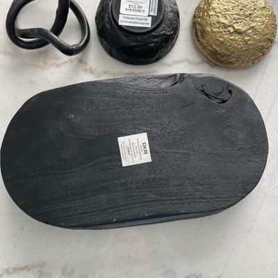 Black and gold decor with wood server