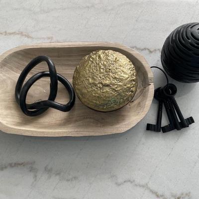 Black and gold decor with wood server