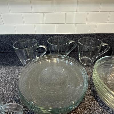Beautiful glass sets including plates, mugs and bowls.
