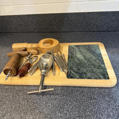 Marble and wood cheese cutting board and utensils