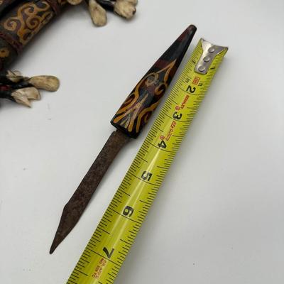 Sale Photo Thumbnail #415: *Missing the main blade

This is a striking Dayak tribal knife with its original scabbard, originating from Borneo (Kalimantan, Indonesia). Richly decorated and deeply symbolic, this ceremonial piece reflects the craftsmanship and cultural traditions of t