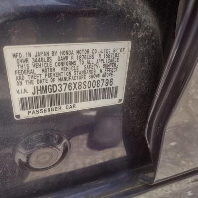 Sale Photo Thumbnail #126: 2007 Honda Fit 4 Speed Manual Shift.  Starts and drives.  Will need a new battery.  Prepare to tow off lot due to unknown condition of tires.  Cosmetic exterior paint peeling and dents as shown.   No warranties or guarantees.  As is where it sits.  Cash, 