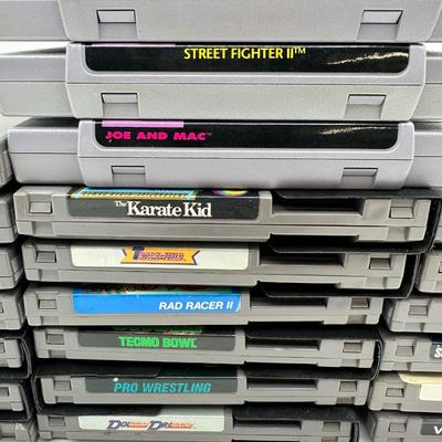 Sale Photo Thumbnail #499: SNES Games:
	•	Street Fighter II Turbo
	•	Street Fighter II
	•	Joe and Mac
	•	WWF Super WrestleMania
	•	Super Baseball Simulator 1.000
	•	NES Games:
	•	Metroid
	•	Final Fantasy
	•	Tecmo Bowl
	•	Rad Racer II
	•	Pro Wrestling
	•	Exci