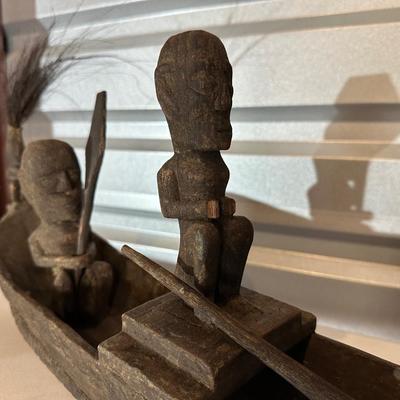 Sale Photo Thumbnail #583: Vintage Indonesian Tribal canoe 

*The figure in the middle is missing his hands. 
Pictured