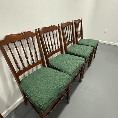 Four antique wood chairs with pretty green upholstery