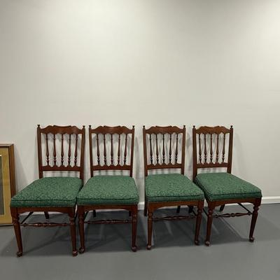 Four antique wood chairs with pretty green upholstery