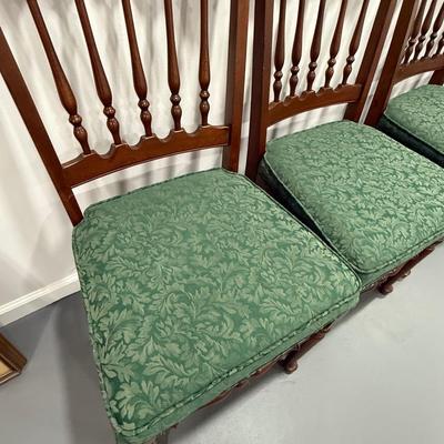 Four antique wood chairs with pretty green upholstery