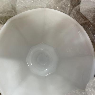 Box filled with milk glass