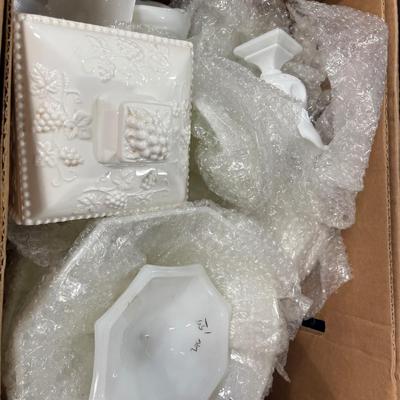 Box filled with milk glass