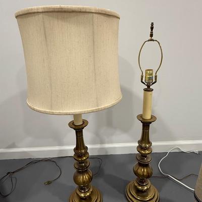 Pair of brass lamps, one without shade