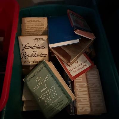 Two large bins of books, mostly religious themed