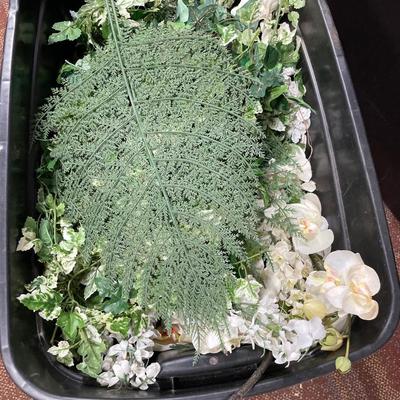 Tote of faux flowers and mini trees