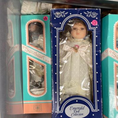 Dolls in grey tote