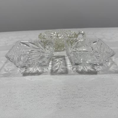 Three crystal pieces including two matching trays