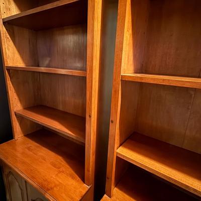 Two matching beautiful wood bookcases with cabinets