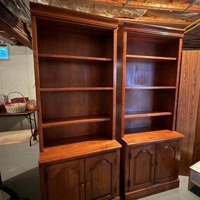 Two matching beautiful wood bookcases with cabinets