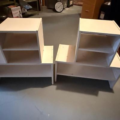 Four white shoe cubes and holders