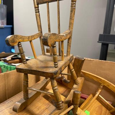 Green tote of doll furniture