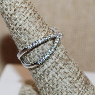 Size 7 Half Infinity Style Criss-Cross Ring with 2 Rows of Small Stones on a Silver Tone Band (2.8g)