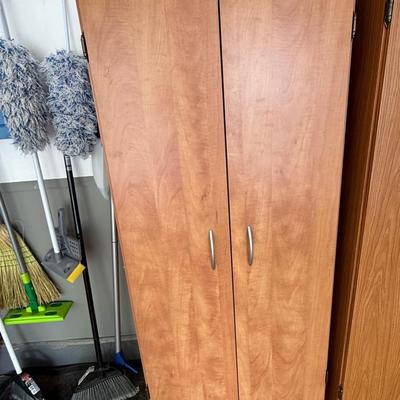 Storage cabinet with silver pulls