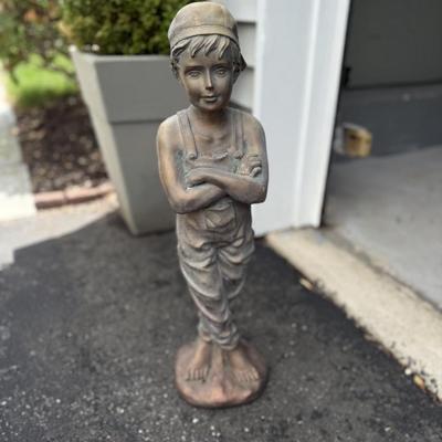 Resin statue of boy
