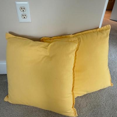 Pair of yellow throw pillows