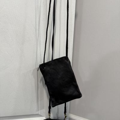 Two small leather satchels, one is Wilson leather