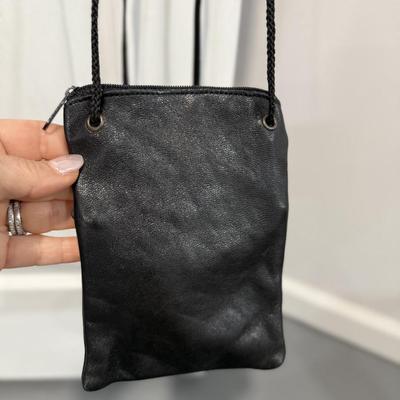 Two small leather satchels, one is Wilson leather