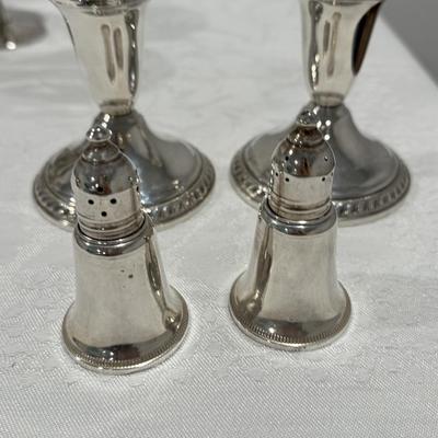 Sterling silver candlesticks and salt and pepper shakers