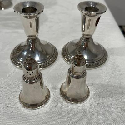 Sterling silver candlesticks and salt and pepper shakers