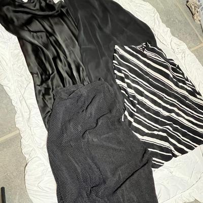 Lot 149 4 black skirts - 2 solid, 1 stripe, 1 polka dot