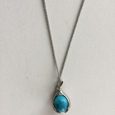 Beautiful hands in world fashion necklace