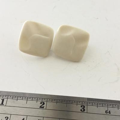 Unmarked vintage white clip on earrings