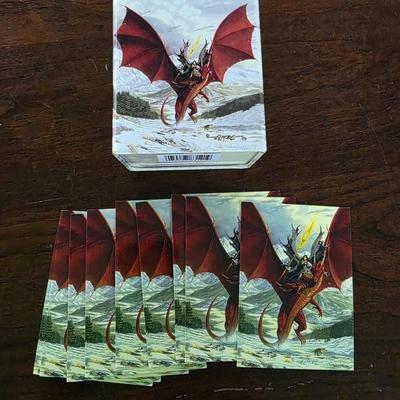 Lot of 54 yugioh cards with deck sleeves and tin