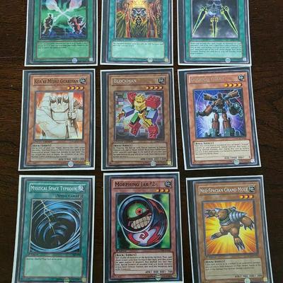 Lot of 54 yugioh cards with deck sleeves and tin