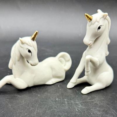 Sale Photo Thumbnail #410: Ceramic with gold horns and painted eyes. Prone figurine has a small imperfection near the left eye (see photo).